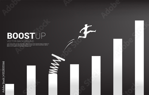 Silhouette of businessman jump to higher column of graph with springboard. Concept of boost and growth in business