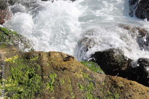 waves crashing on rocks in sea 