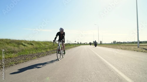 Triathlete cycling road bike, Pedaling Road Bicycle, sport concept photo