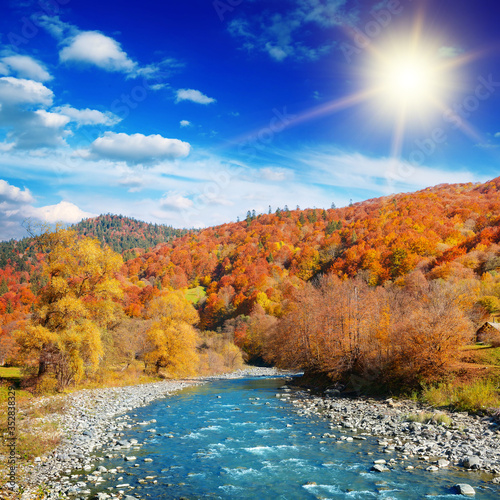 Bright autumn landscape with bright sun.
