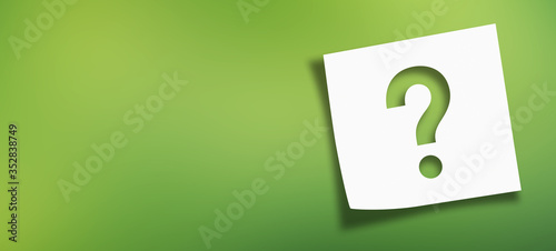 Note paper with question mark on panoramic abstract green background	 photo