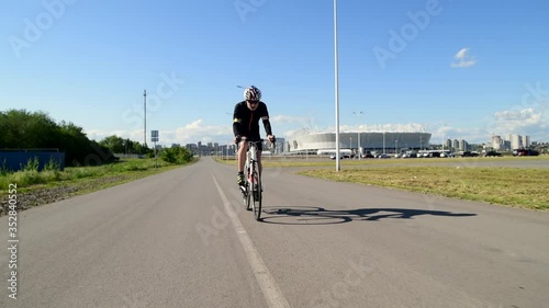 Young Sportsman cycling road bike, Triathlon Road Bicycle, sport concept photo