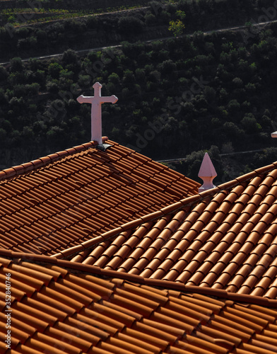 Chapel roof over the Douro Valley beautiful endless lines of Vineyards, in Peso da Regua, Vila Real, Portugal.