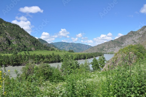 The Katun River flows among the top Altai Mountains