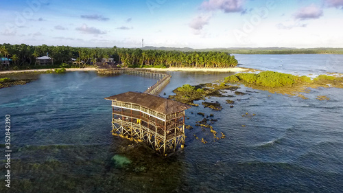 Aerial of boardwalk of famous Cloud 9 at late afternoon, General Luna, Siargao, Philippines. photo