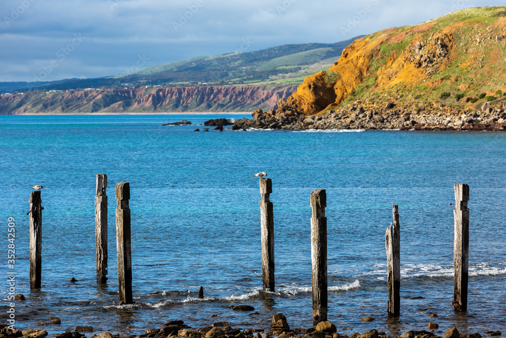 The iconic jetty ruins located on the Myponga beach on the Fleurieu Peninsula South Australia on the 24th May 2020 The iconic jetty ruins located on the Myponga beach on the Fleurieu Peninsula South Australia on the 24th May 2020