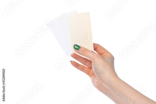 Woman's hand showing white paper banner isolated on white