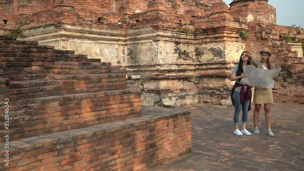 Slow Motion/Traveler Asian woman spending holiday trip at Ayutthaya, Thailand Slow Motion/Traveler Asian woman spending holiday trip at Ayutthaya, Thailand