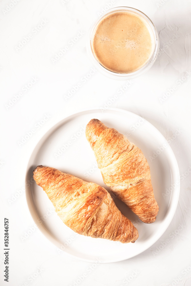 Croissants and coffee in the style of minimalism. Croissants and coffee in the style of minimalism.