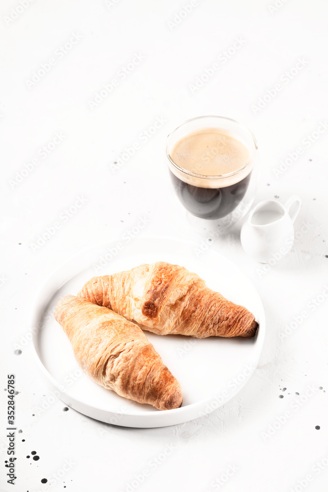 Croissants and coffee in the style of minimalism. Croissants and coffee in the style of minimalism.