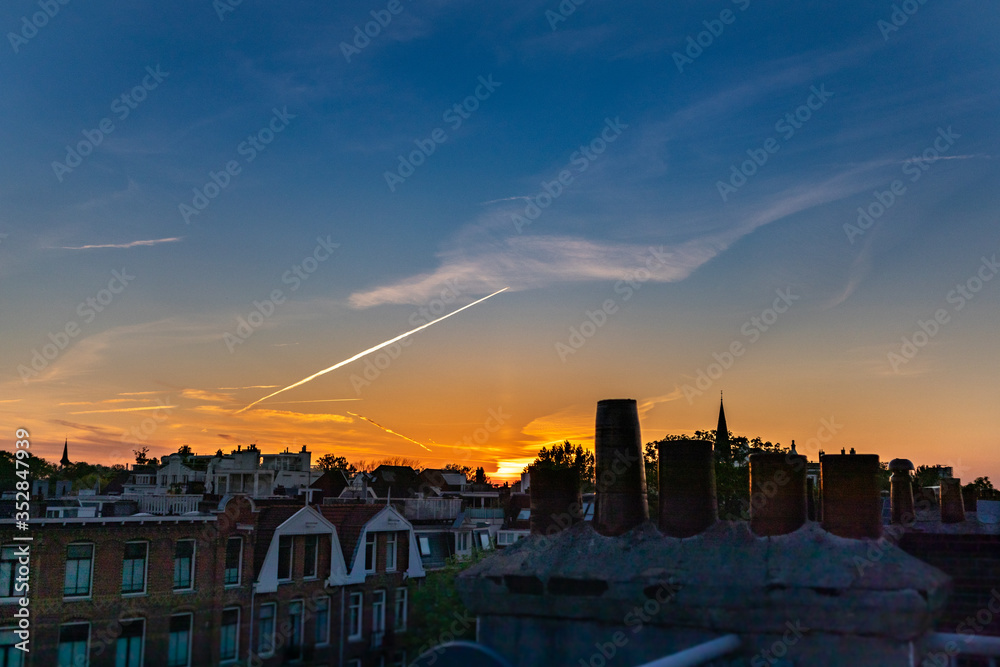 Inner city panoramic rooftop shot of the sunset sky
