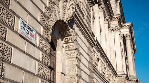 Parliament Street and Whitehall are  synonymous with UK government.  The street sign is attached to HM Treasury, known as The Exchequer. photo