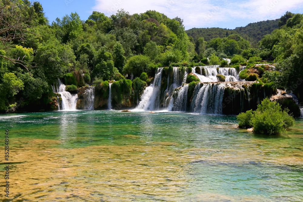 Beautiful waterfalls in National Park Krka, Croatia on a sunny summer day. 