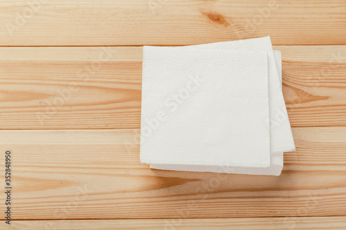 white paper napkin with a textured pattern on an old table
