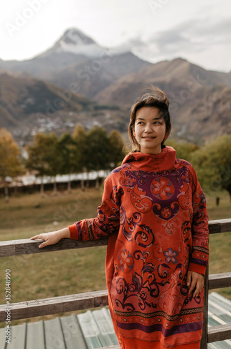 Beautiful smiling Asian Girl tourist in the mountains. photo