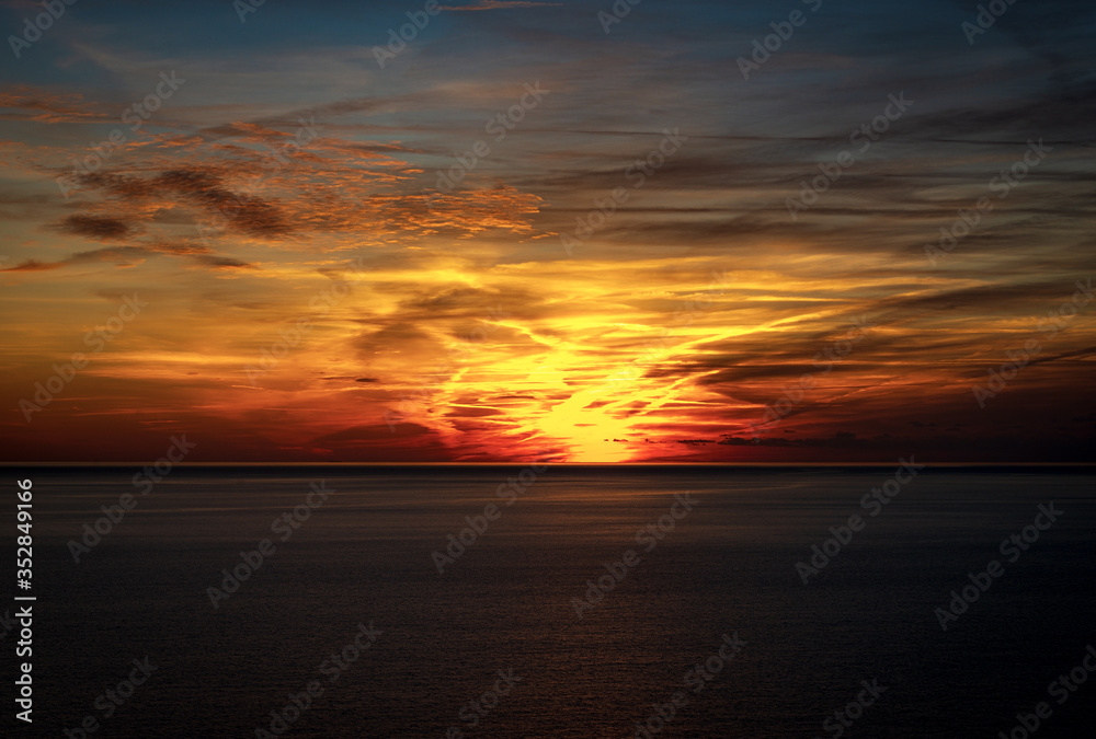 Beautiful sunset with a dramatic sky on the horizon, Mediterranean sea in front of the Cinque Terre, Liguria, Italy, Europe