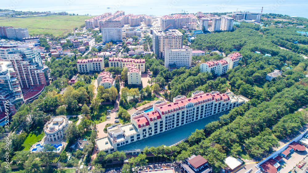 Residential multi-storey complex on the shore of Gelendzhik Bay, Gelendzhik resort on a clear Sunny day. From a bird's eye view
