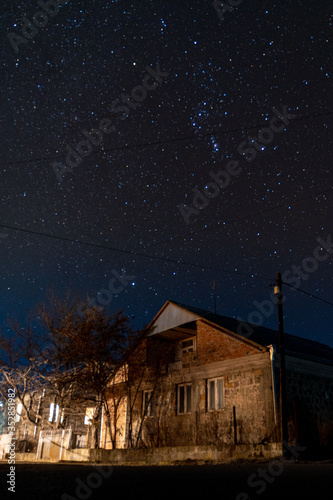 Armenia, autumn, 2019: old hut in the night with sky full of stars