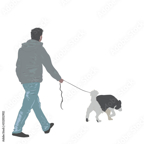A man walks with a dog on a leash