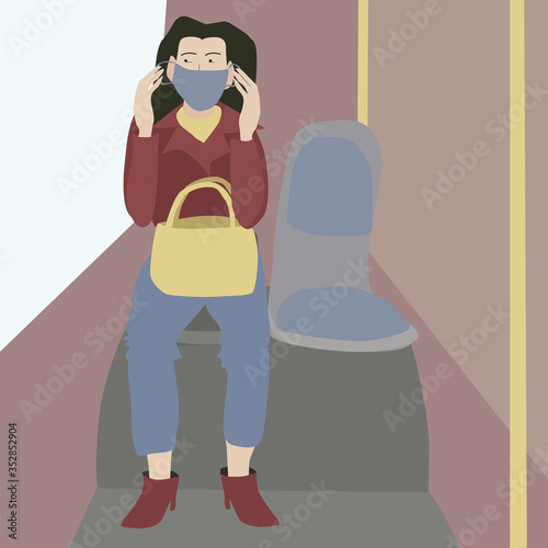A woman puts on a mask in a public place