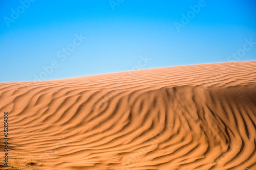 Ripple sand dunes and blue sky background, Perry Sandhills, Australia