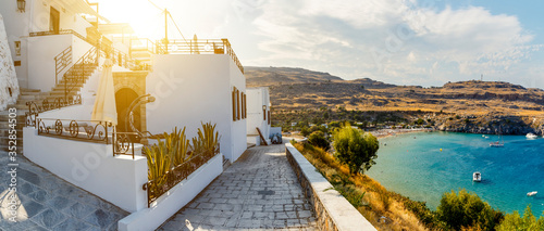 beautiful house in Lindos on background of the bay, yachts and ships Rhodes Greece photo