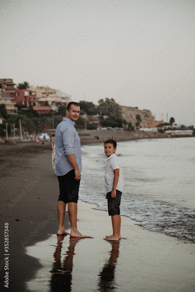 Father with son playing on the beach. Father's Day!