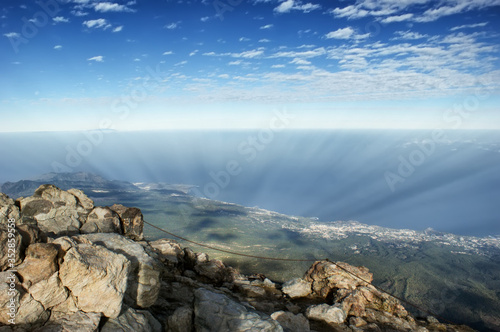 View from the top of a volcano Teide to the island of Tenerife. Cloud shadows are visible on the ground.