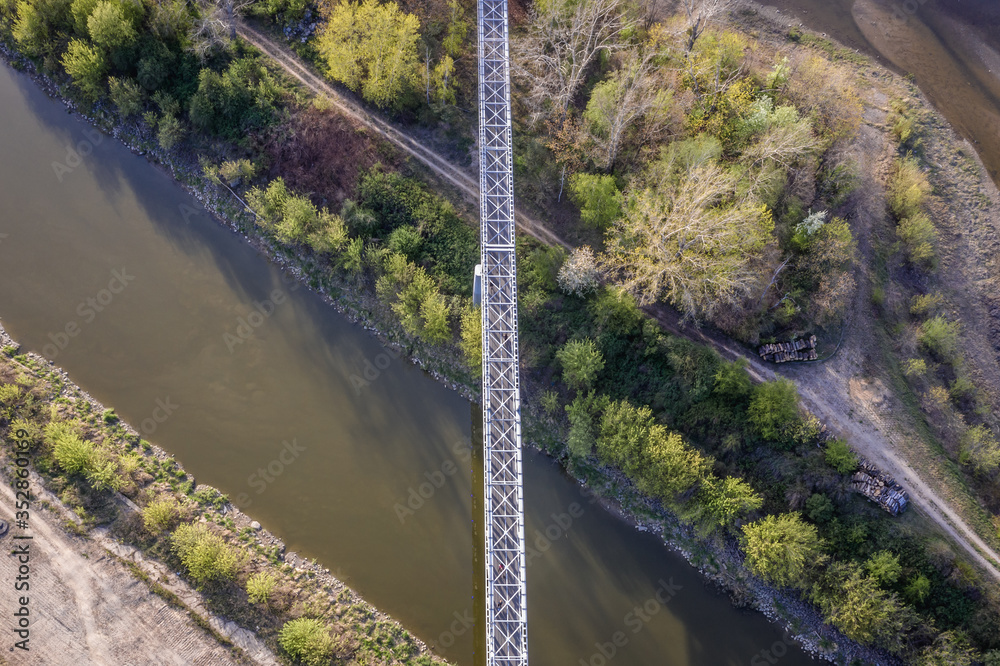 Drone view on the pedestrian and bike footbridge over Zeran water canal in Warsaw, Poland