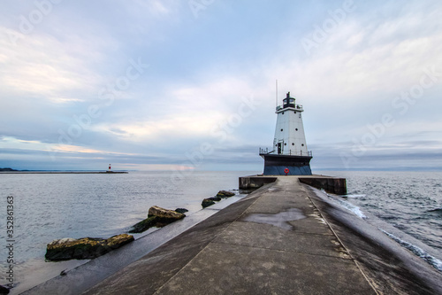 Ludington Lighthouse. Lighthouse on the coast of Lake Michigan under an overcast grey sky.