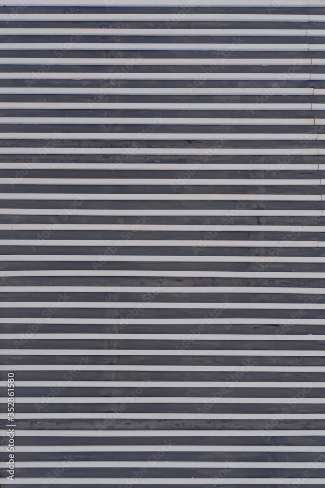 Industrial-style wall background with horizontal metal strips