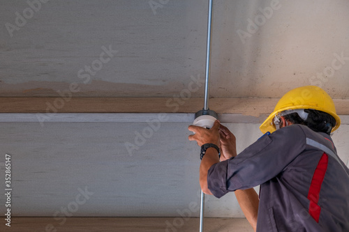 technician Checking doing work Maintenance fire alarm system in a factory Fire protection Factory safety Qiao Shan