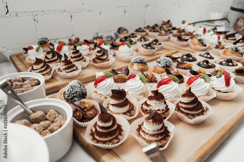 A buffet table. Sweet desserts. Fourchette at the party. Sweet buffet at the party. 