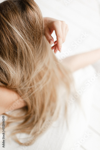 A girl's hair close-up. Blonde hair. Morning hair in bed. 