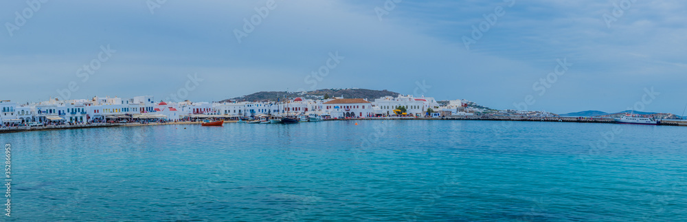 View of the famous pictorial narrow streets of Mykonos town in Mykonos island, full of colors and people. next to Little Venice and its Windmills. 