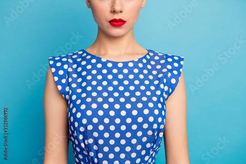 Cropped closeup photo of pretty lady show perfect red lips allure tempting shape not smiling ideal contour wear dotted white retro blouse shirt isolated blue color background photo