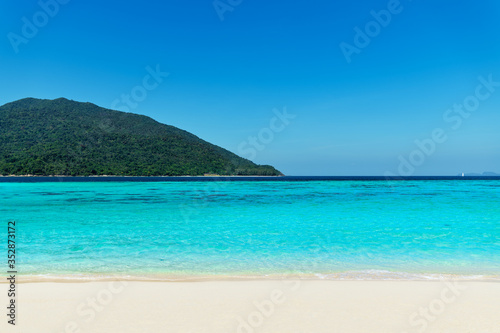 Turquoise clear sea and white sand beach on tropical island © GVS