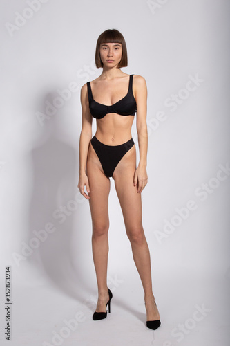 model snaps front in black underwear isolated on white © veles_studio