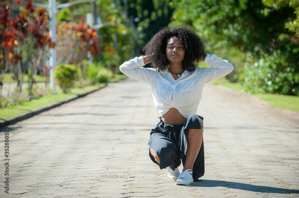 happy black young woman in the park happy black young woman in the park