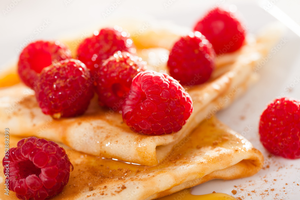 delicious pancakes with fresh raspberries and honey delicious pancakes with fresh raspberries and honey
