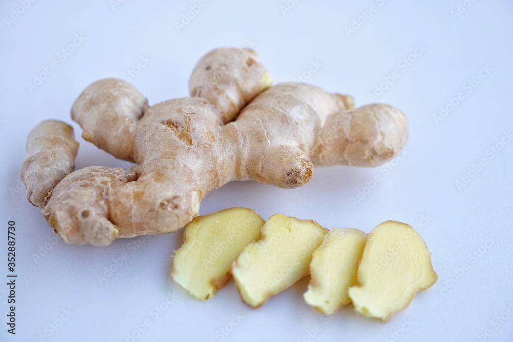 Organic fresh ginger root on white background with blue light tone