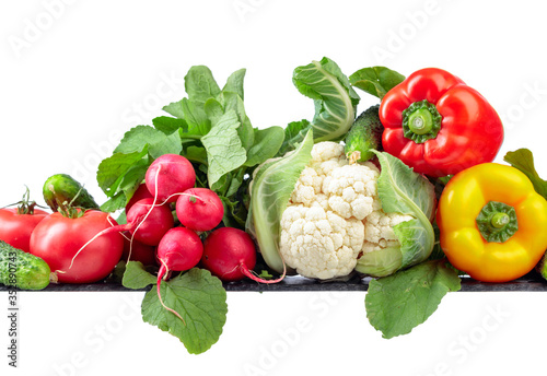 Various fresh raw vegetables isolated on white background.