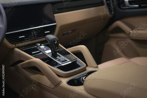 Modern luxury car background. Interior detail. © alexdemeshko