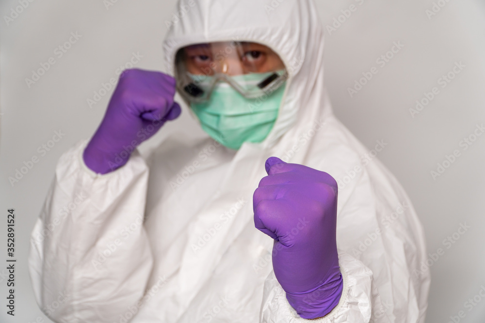 Doctors in protective suits and masks prepare to fight against virus outbreak, The Concept of spreading Coronavirus (COVID-19) around the world. Stay at home stop spreading the virus. Doctors in protective suits and masks prepare to fight against virus outbreak, The Concept of spreading Coronavirus (COVID-19) around the world. Stay at home stop spreading the virus.