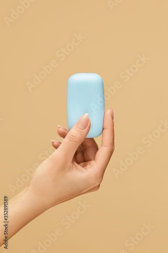 Hygiene. Soap Bar In Caucasian Female Hand On Beige Background. Daily Personal Hygiene Routine And Skin Care For Virus Prevention. Wash Your Hands For Staying Healthy.
