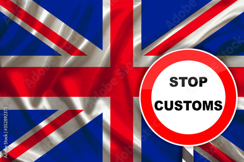 customs sign  stop  attention on the background of the silk national flag of Great Britain  the concept of border and customs control  violation of the state border  tourism restrictions