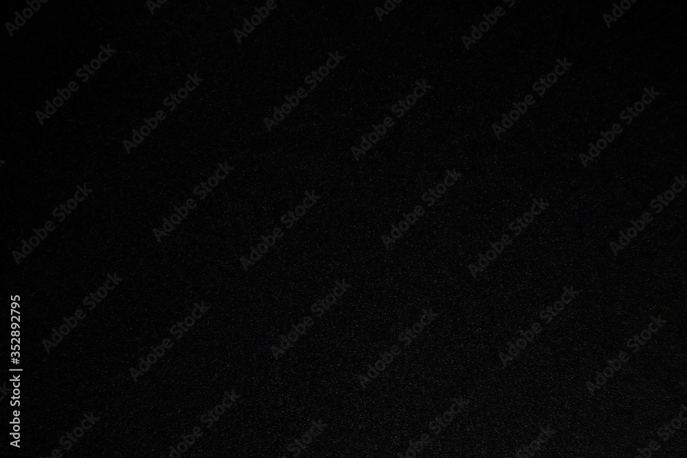 Black paper texture for background.