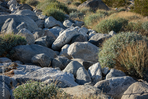 Granite boulders in a dry riverbed photo