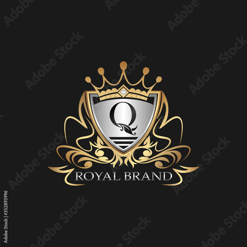 Q Letter Gold Shield Logo. Elegant vector logo badge template with alphabet letter on shield frame ornate vector style  design.