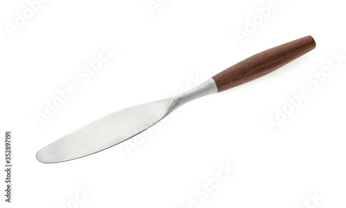 Serving table knife with a wooden handle on a white background